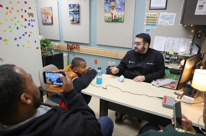 This is a photo of DuJuan Broadus Jr. and his parents at his cochlear implant activation appointment on Jan. 9. Carter Skaggs | UK Photo