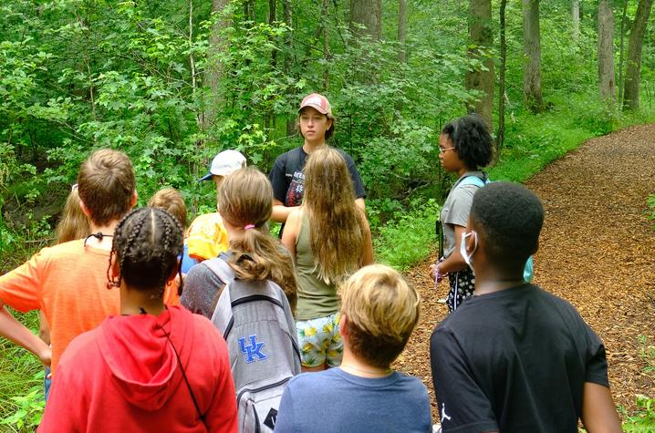 This is a photo of High school students learning though hands-on activities such as tree identification. Photo by Matt Barton.