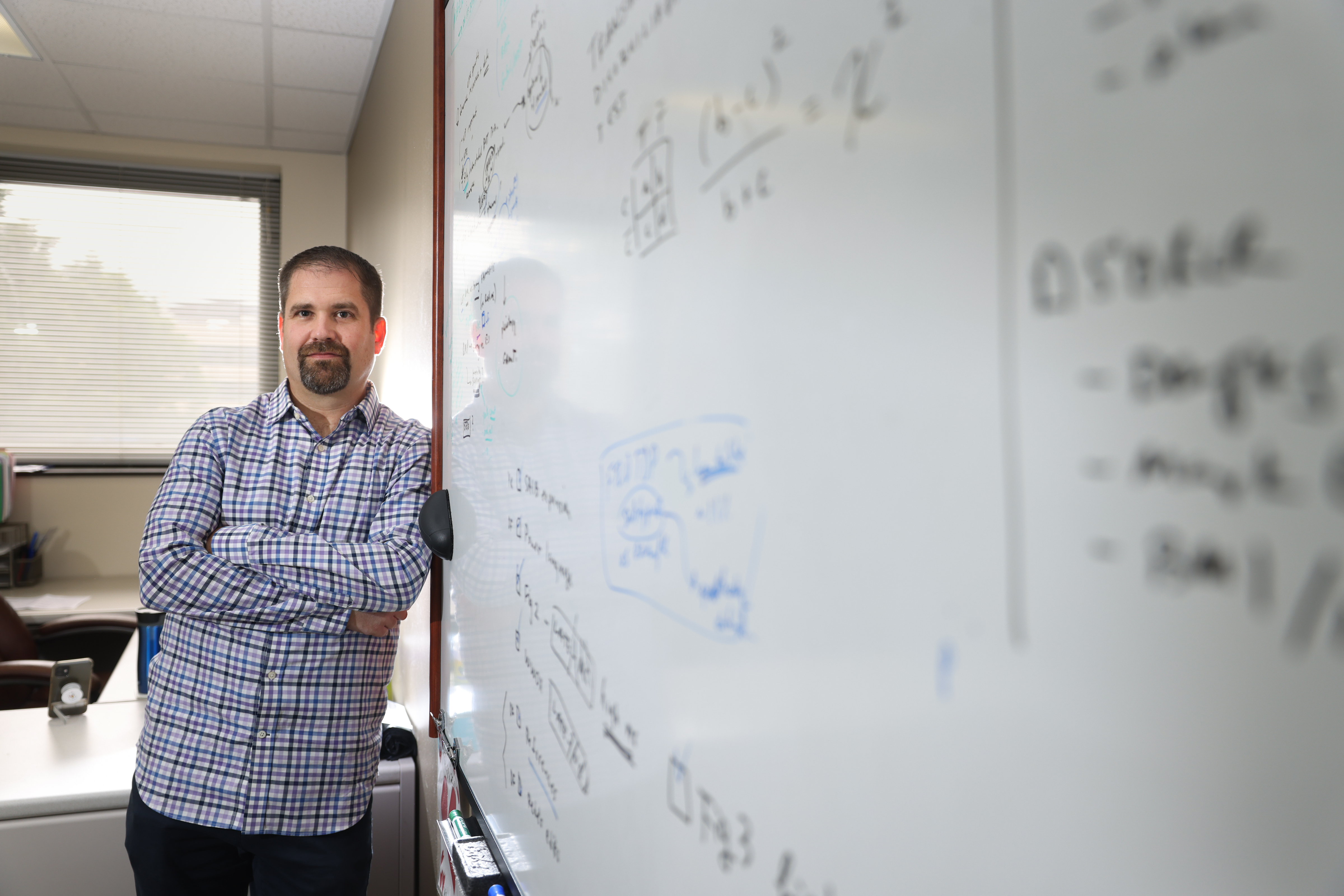 This is a photo of David Fardo, Ph.D., who is supported by the National Institute of Aging, National Institute of Neurological Disorders and Stroke and the National Institute of General Medical Sciences. UK Photo