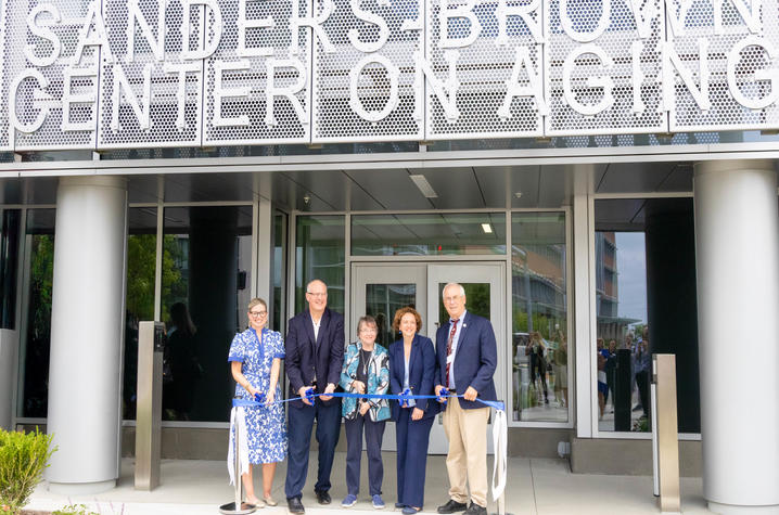 This is a photo of Carla Blanton, Pete Nelson, Linda Van Eldik, Ilhem Messaoudi and Chipper Griffith as they cut the ribbon on the renovated Sanders-Brown research facility. Hilary Brown | UK Photo