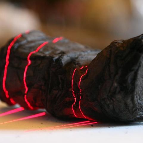 an object being scanned with red lasers. 