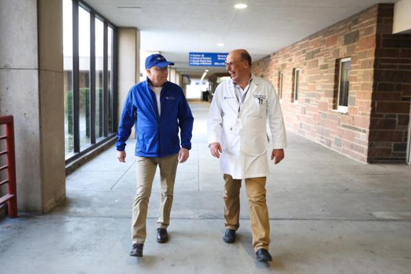 This is a photo of Andy Biermann, left, with Matthias Loebe, M.D., Ph.D., right, at UK Chandler Hospital. Carter Skaggs | UK Photo