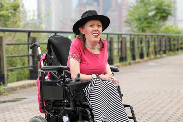 This is a photo of Alumna Kelly Berger, who advocates for meaningful change. Photo by Maddie Graves Photography.