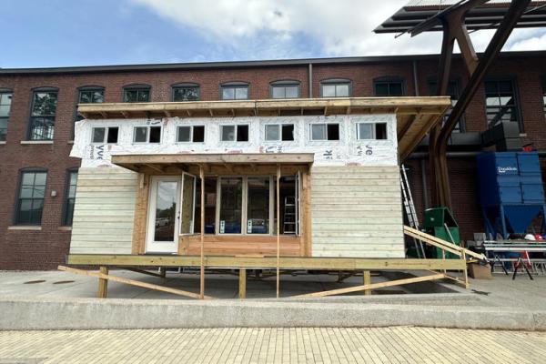 This is a photo of a full-size, modular home prototype for emergency housing , which the College of Design students designed and built . Photo by Meg Mills.