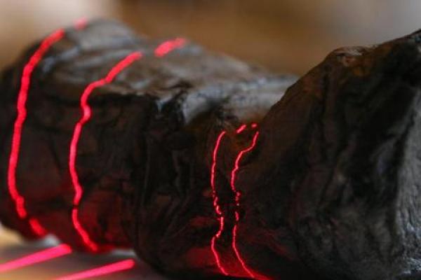 an object being scanned with red lasers. 