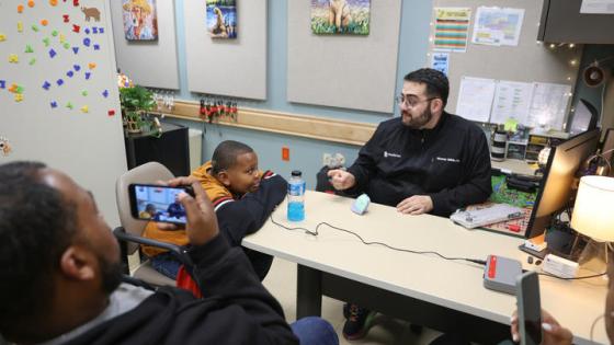 This is a photo of DuJuan Broadus Jr. and his parents at his cochlear implant activation appointment on Jan. 9. Carter Skaggs | UK Photo