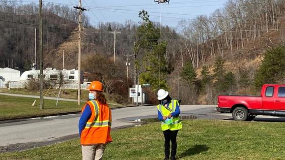 This is a photo of Kentucky Homeplace community health workers Chyna Smith, left, and Carole Frazier retrieving a package delivery from a drone. Photo courtesy of CERH.