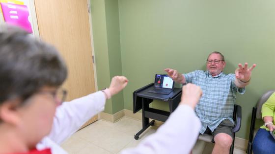 This is a photo of Hoyt “Corky” Ball going through some assessments at a routine DBS-Plus follow up appointment with Julie Gurwell, Ph.D. (Photo by Shaun Ring).