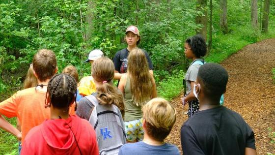 This is a photo of High school students learning though hands-on activities such as tree identification. Photo by Matt Barton.