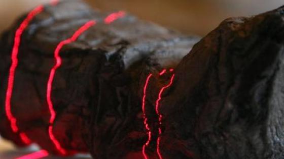 an object being scanned with red lasers. 