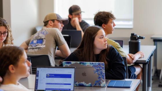 Students listening to a lecture in classroom