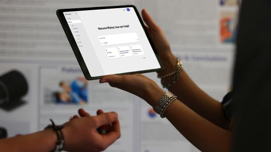 Person holding a tablet. 